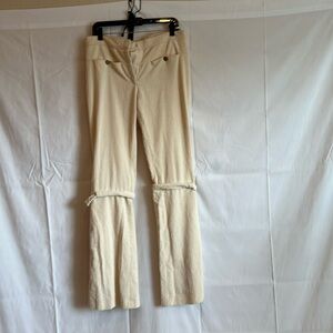 CHANEL CREAM CORDUROY PANTS WITH LEG BUCKLES. Size 42.